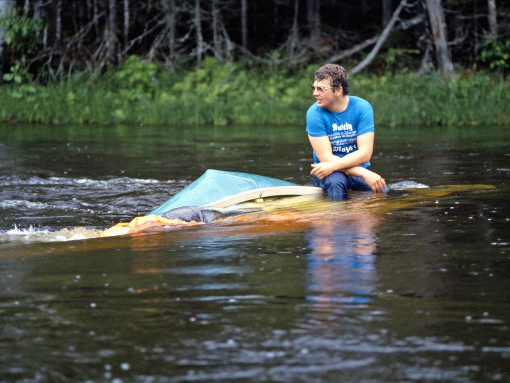 David prepares to rescue a boulder-wrapped canoe on the Allagash Wilderness Waterway in northern Maine