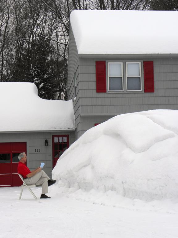 reading to a big snow pile instead of canoeing on the Allagash Wilderness Waterway in northern Maine