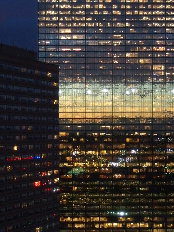 sunset colors reflected off the John Hancock building in Boston