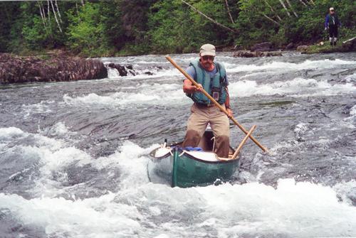 Mike poles a canoe on the Bonaventure River in Quebec in June 2001