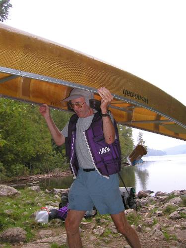 Mitch portages a canoe at Quetico Park in Ontario, Canada, in September 2003