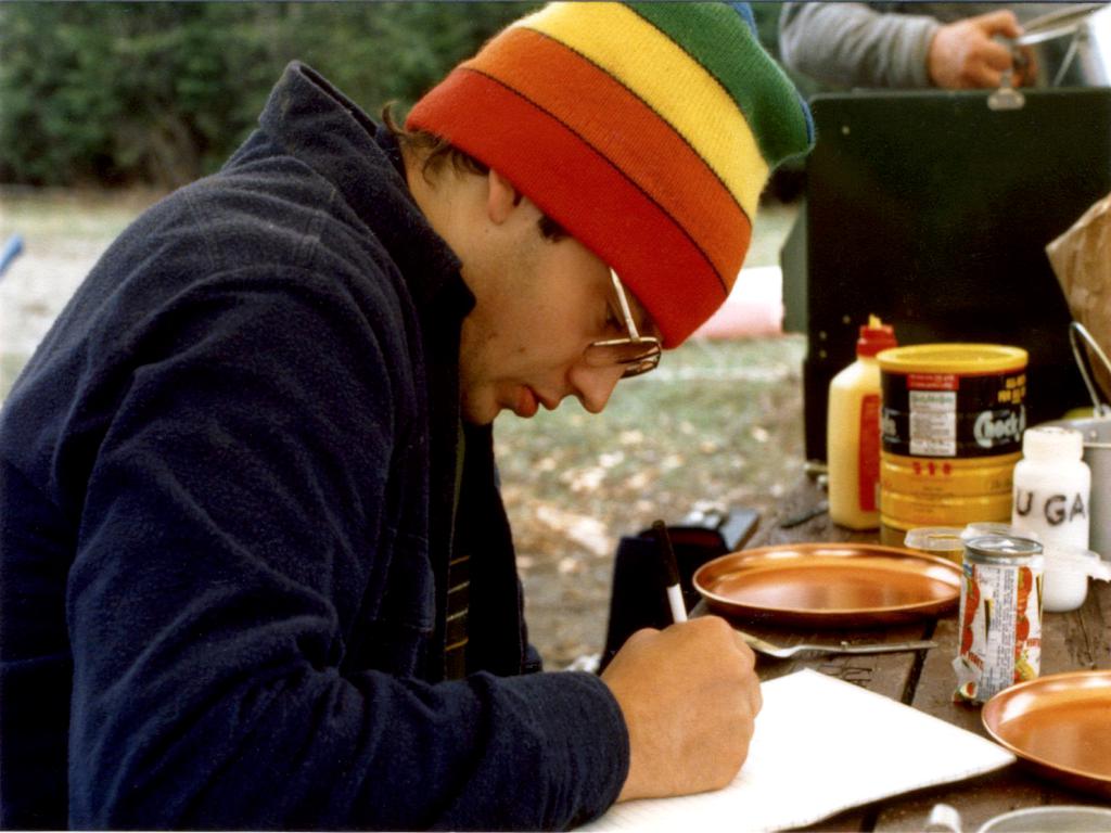 Dave catches up on his writing at a riverside campsite on the St John River in Maine in May 1984