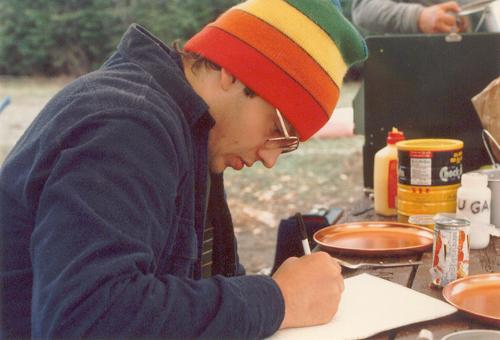 Dave catches up on his writing at a riverside campsite on the St John River in Maine in May 1984