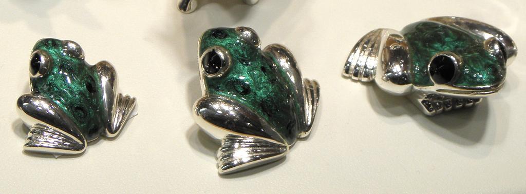 trio of enameled frogs