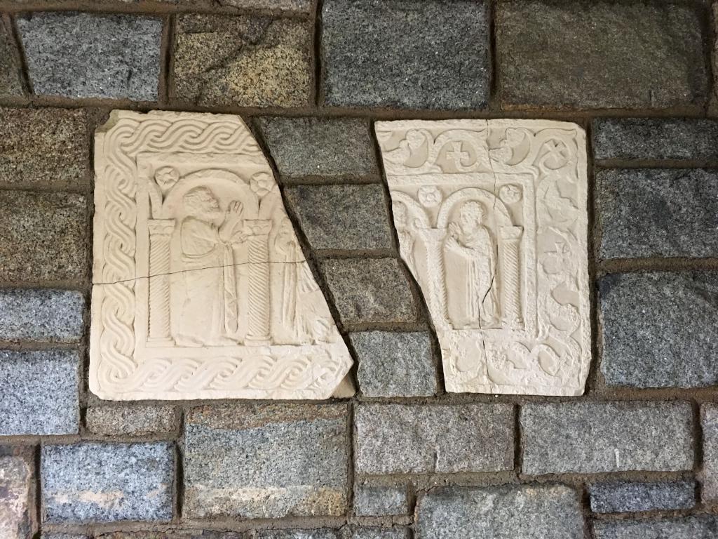 stone wall decor inside the entrance gate at Hammond Castle in Gloucester, Massachusetts