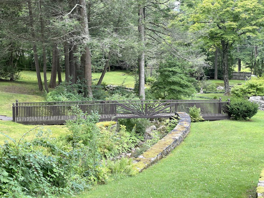 footbridge in August at Ashintully Gardens in western MA