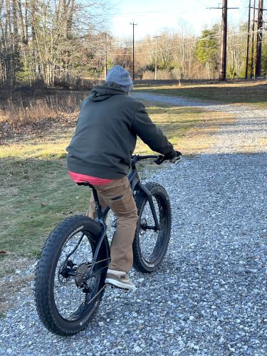 biker in November on the Bedford Heritage Trail near Bedford in southern NH