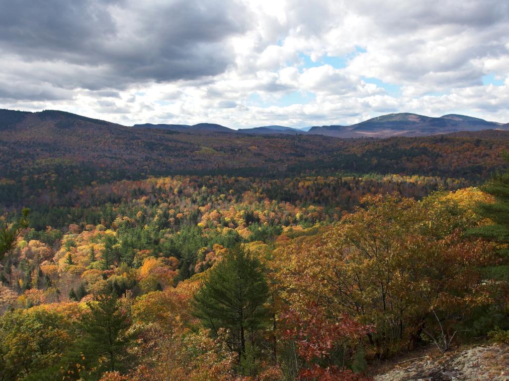 view west in October toward the White Mountains of New Hampshire from Browns Ledge in western Maine