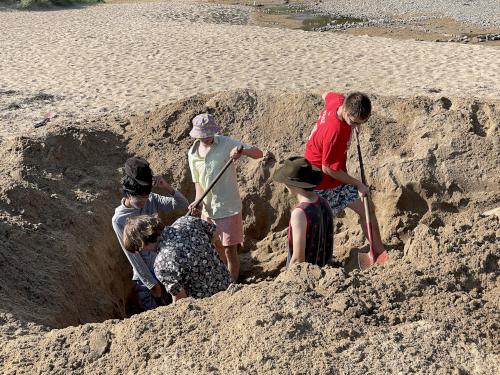 digging in August on Sand Beach near Great Head at Acadia National Park in Maine