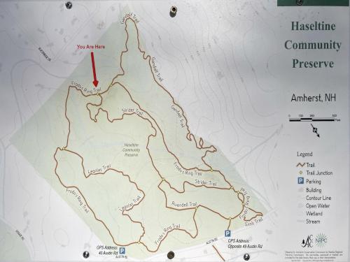 map in December at a trail intersection of the Haseltine Community Preserve in southern NH