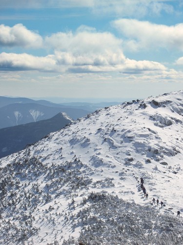 February hikers climb the ridge to Mount Lincoln on Franconia Ridge in New Hampshire