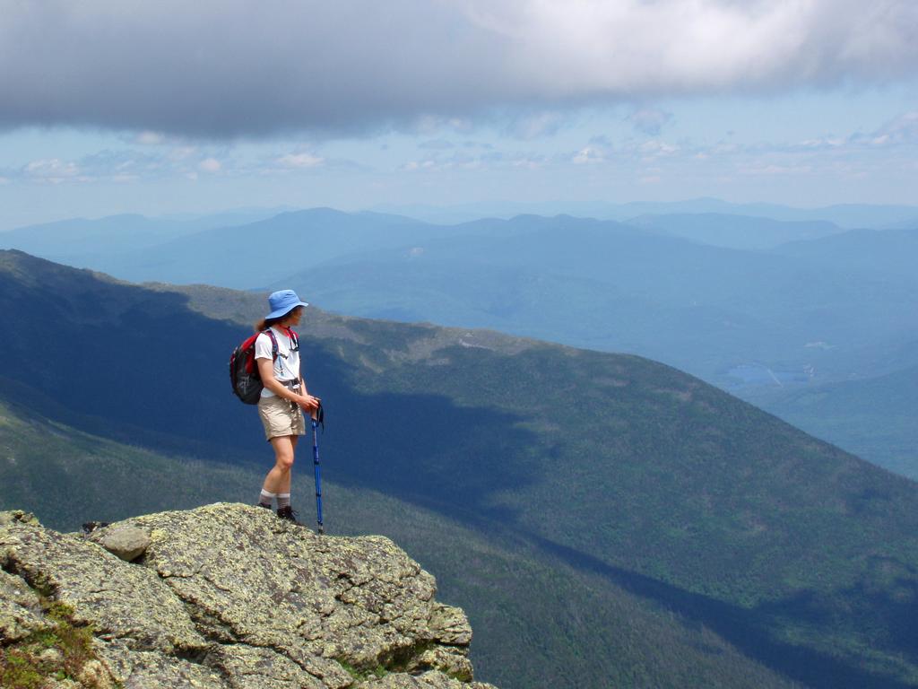 hiker out standing on the edge of Mount Clay in New Hampshire