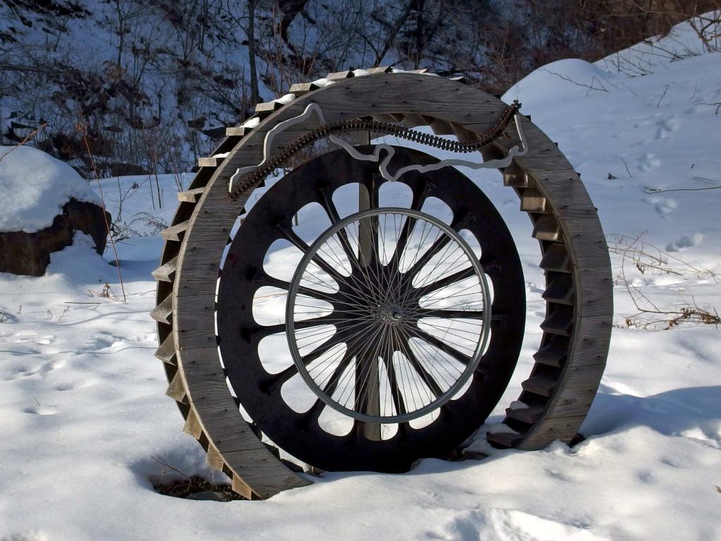 wheel modern-art sculpture in January at Mascoma River Greenway at Lebanon in western New Hampshire