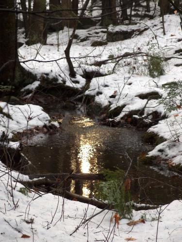 brook in December at Nottingcook Forest near Bow in southern New Hampshire