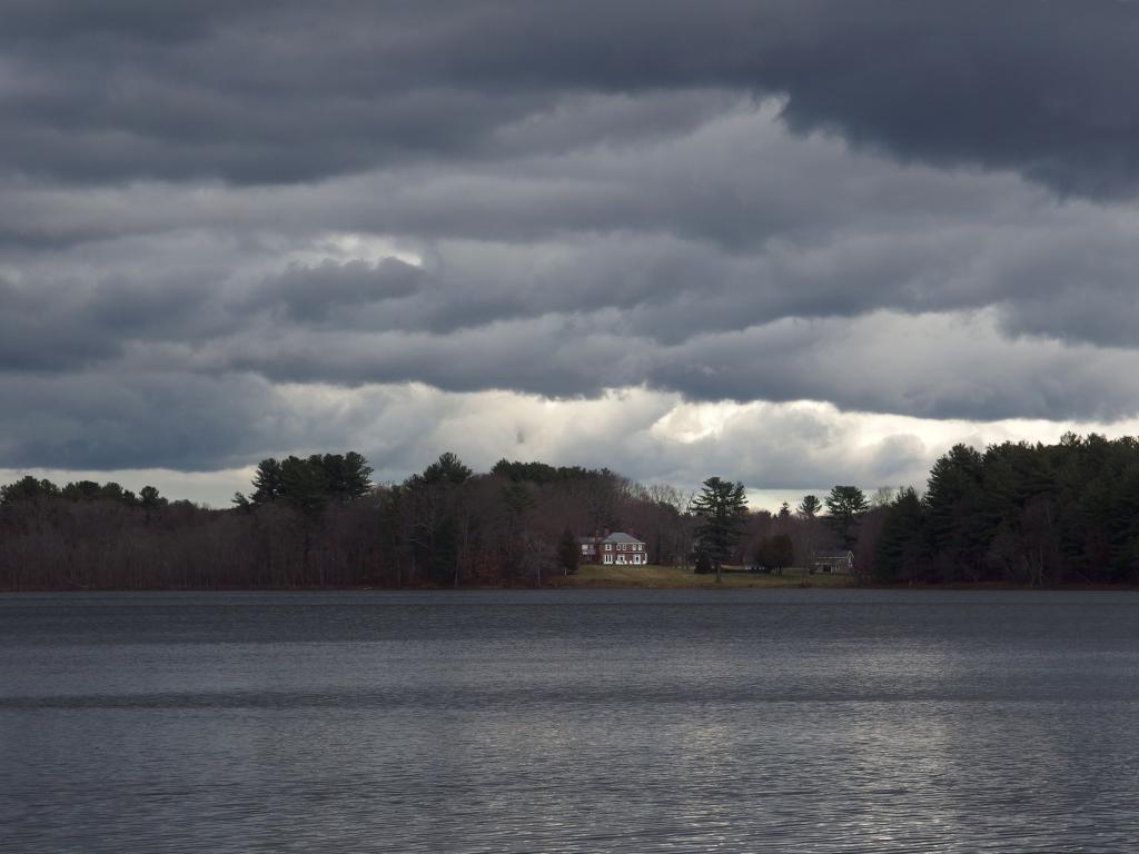 sinister view in December across Wenham Lake at Phillips Nature Preserve in northeastern Massachusetts