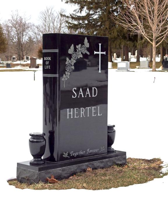 book gravestone in March at Pine Grove Cemetery in Manchester, NH