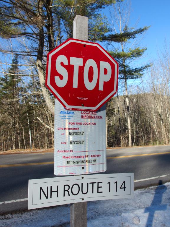 intersection sign where SRKG Trail #5 intersects Route 114 near Royal Arch Hill in southwest New Hampshire