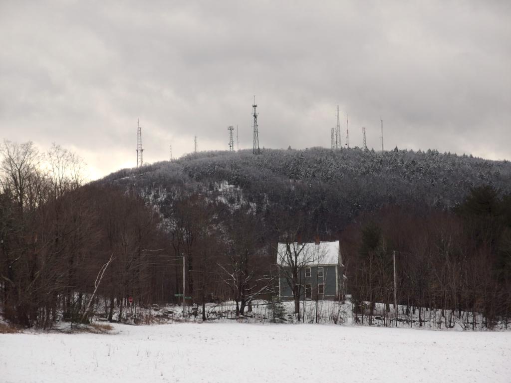 view in January of the antenna farm atop South Uncanoonuc Mountain from Shirley Hill in southern New Hampshire