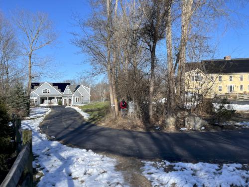 trail in February beside private houses on the Tom Paul Trail at Westford in northeast MA