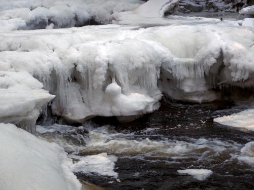 puffy icebergs in February on the Gridley River at Wales Preserve in southern New Hampshire