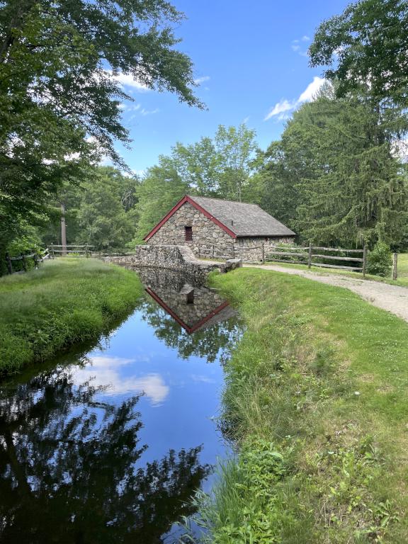 Grist Mill power canal in June at Wayside Inn Historic Site in eastern MA