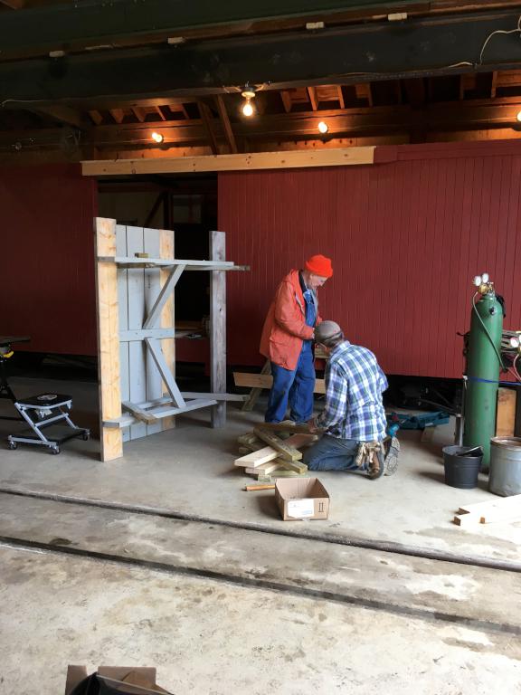volunters at work inside the mainenance building at Wiscasset Railroad in Maine