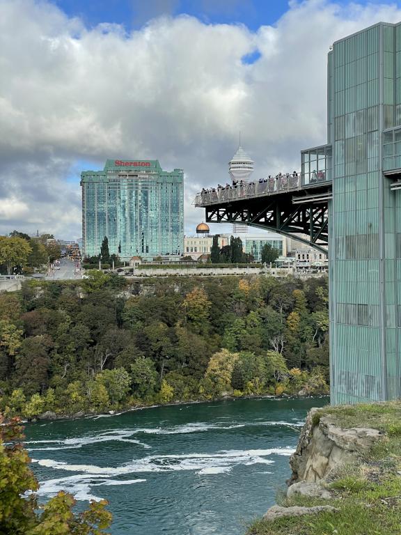 tourists on the viewing platform in October at Niagara Falls in New York