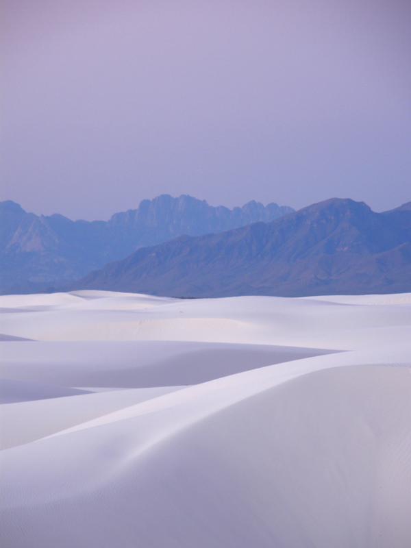 blue early-morning sunrise as seen from a wilderness campsite at White Sands National Monument in New Mexico